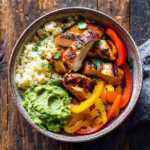 paleo chicken burrito bowl with cauliflower rice and veggies
