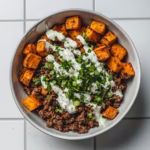 Paleo sweet potato and ground beef bowl in modern kitchen